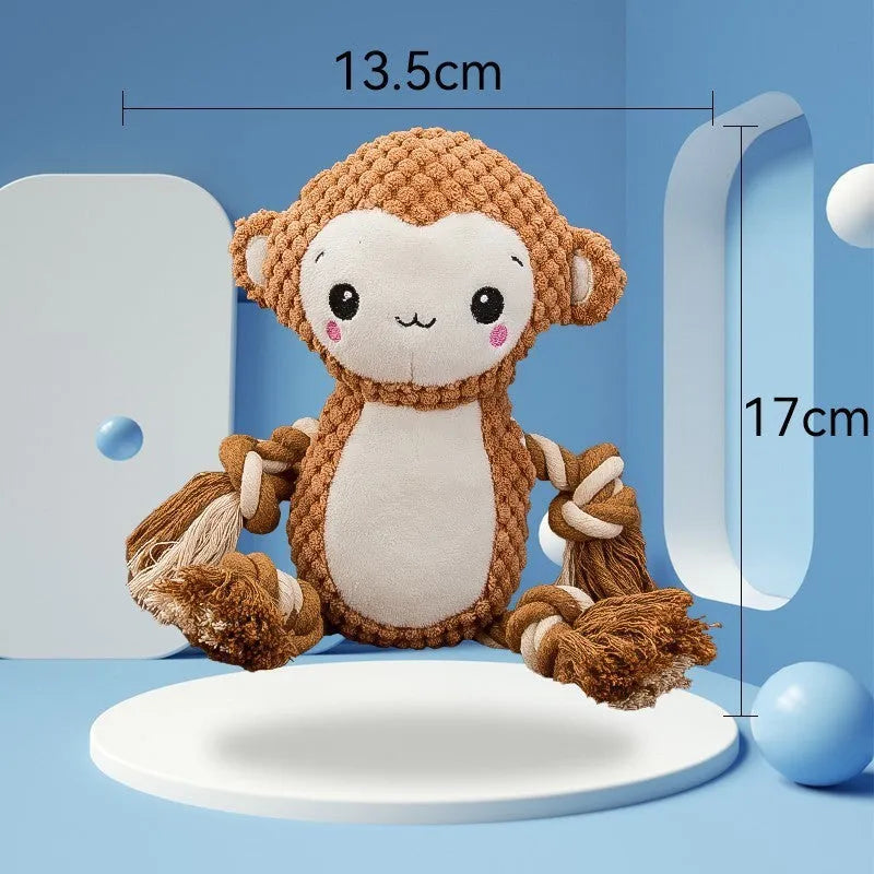 Plush lion and monkey squeaky dog toys side by side on a neutral background.