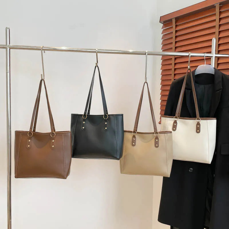 Contrast colour PU leather tote bag showing internal organisation compartments and external slit pocket