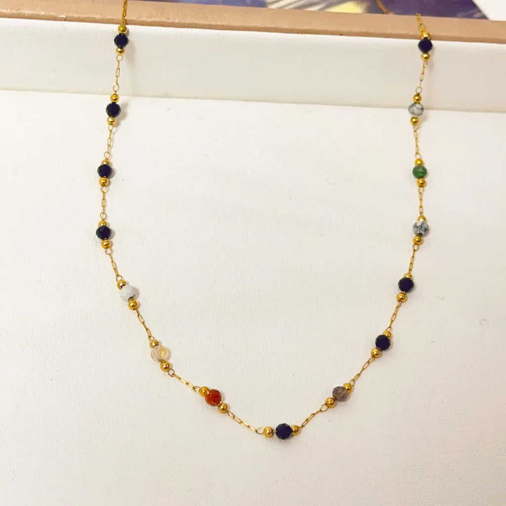 Gold titanium steel women's necklace with a natural stone pendant on an O-ring chain.