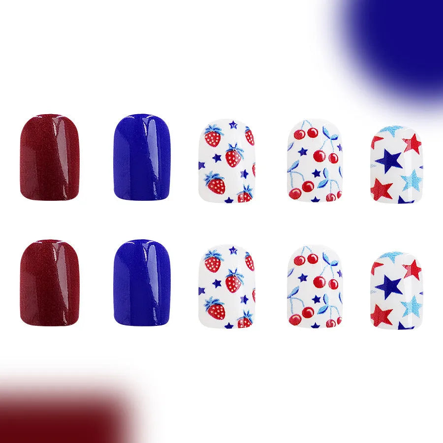24 short glossy false nail stickers with strawberry and cherry patterns in red and blue colours