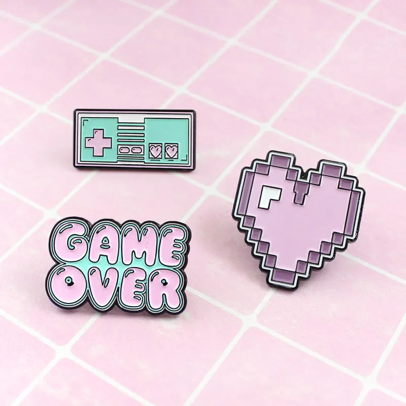 Alloy game console badge with magnetic backing in CC1122, CC1123, and CC1124 colour options