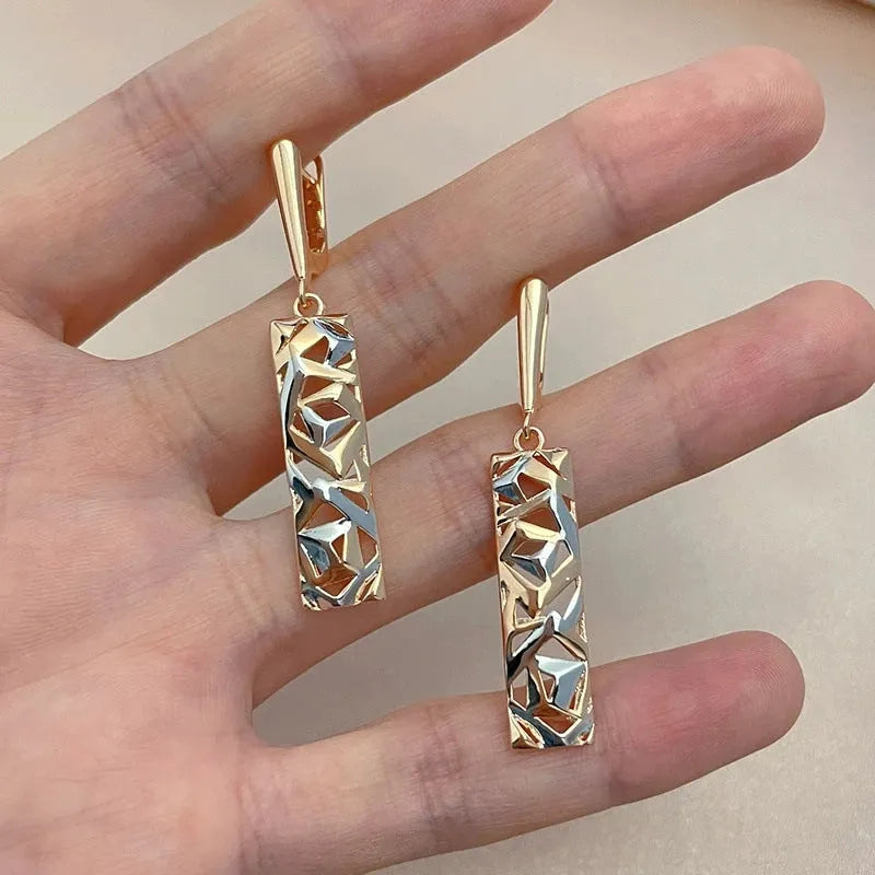 Rectangular hollow stud earrings with two-tone electroplated finish and geometric design