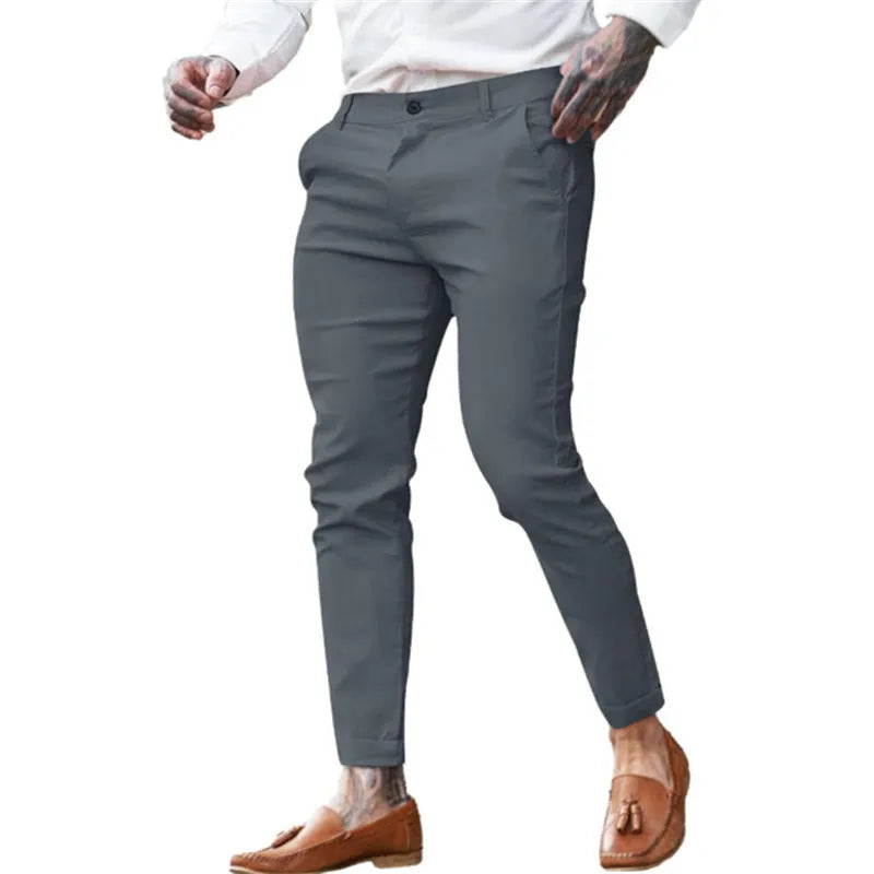 Men's slim-fit pencil trousers in stretch cotton twill fabric, shown in a dark blue colour.