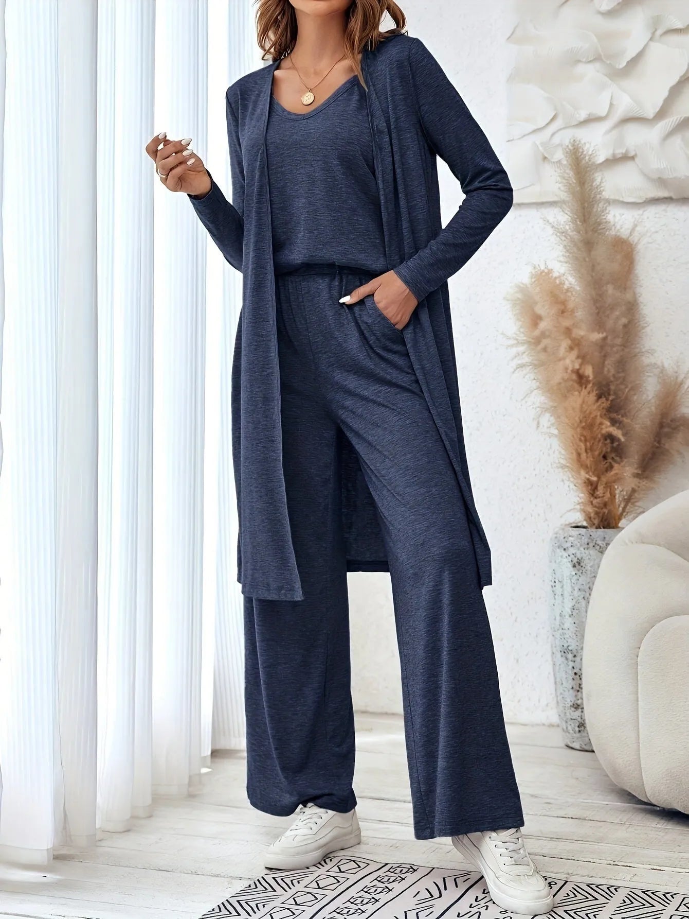 Women's blue three-piece casual suit with sling top, cardigan and trousers