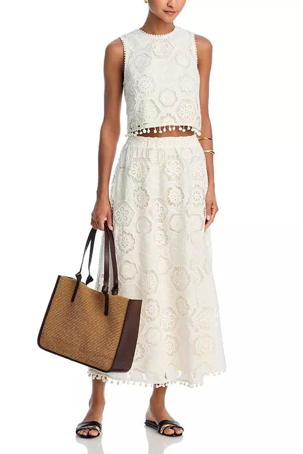 White women's two-piece suit set with embroidered sleeveless top and matching long skirt