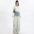 Women's gradient blue straight-leg denim trousers with wide leg design on hanger