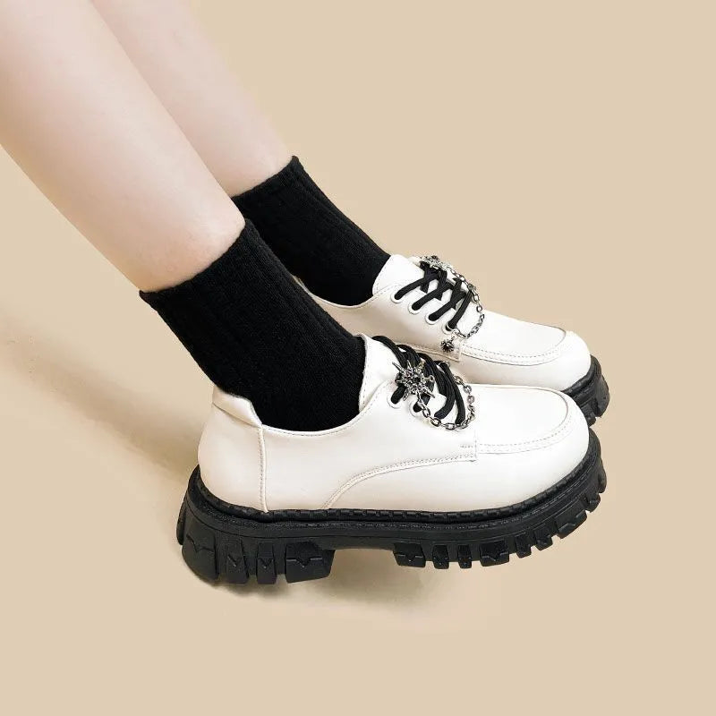 Women's preppy jk style loafers in Duke Asterism colour with metal cross shoulder straps and round toe