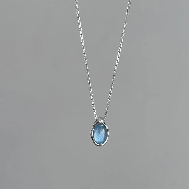 Navy blue geometric water drop necklace with adjustable chain and cross chain design