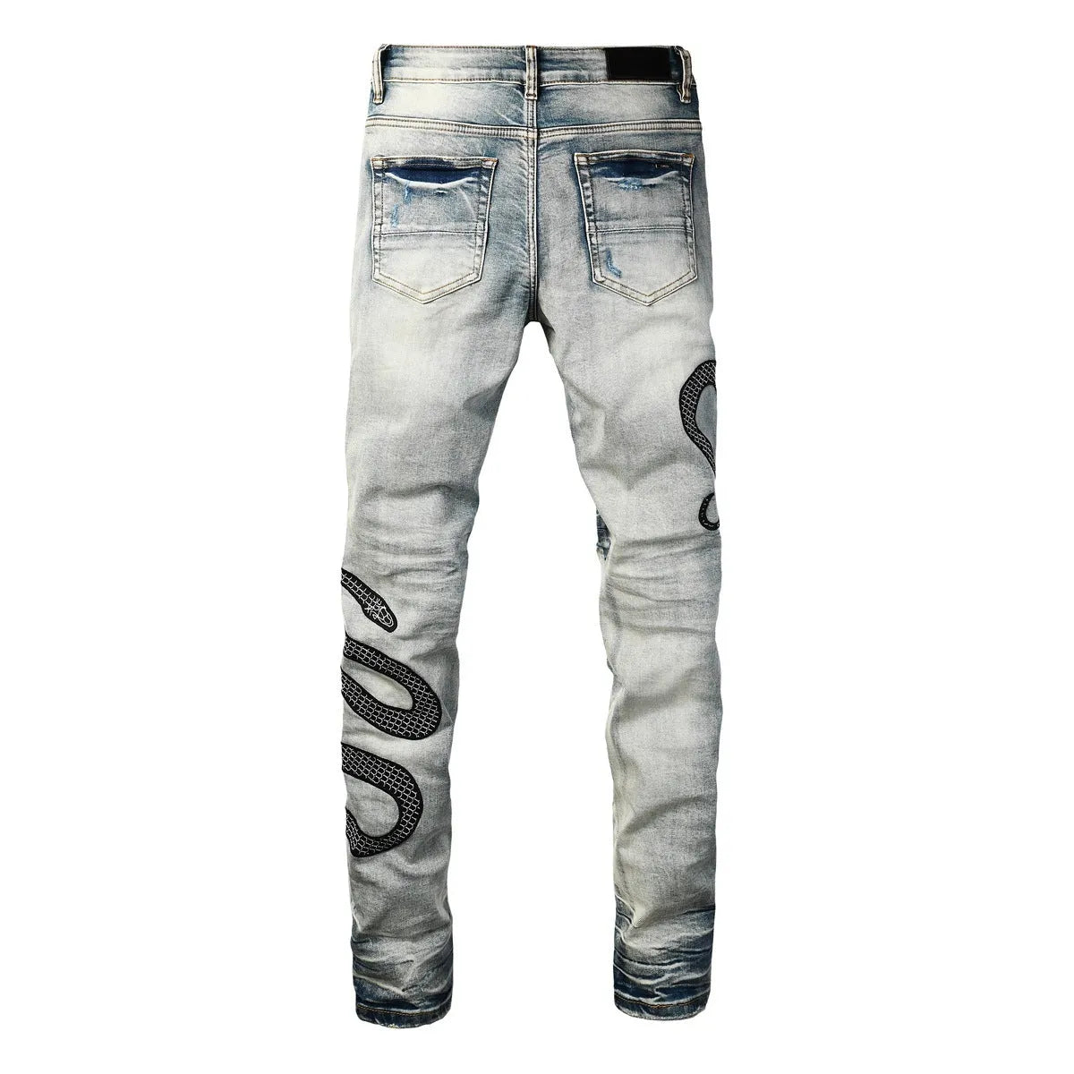 Man's blue distressed skinny jeans with a street fashion wash and button fly.