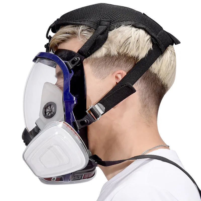 Blue-edged spherical full face gas mask with silicone construction and trapezoidal canister
