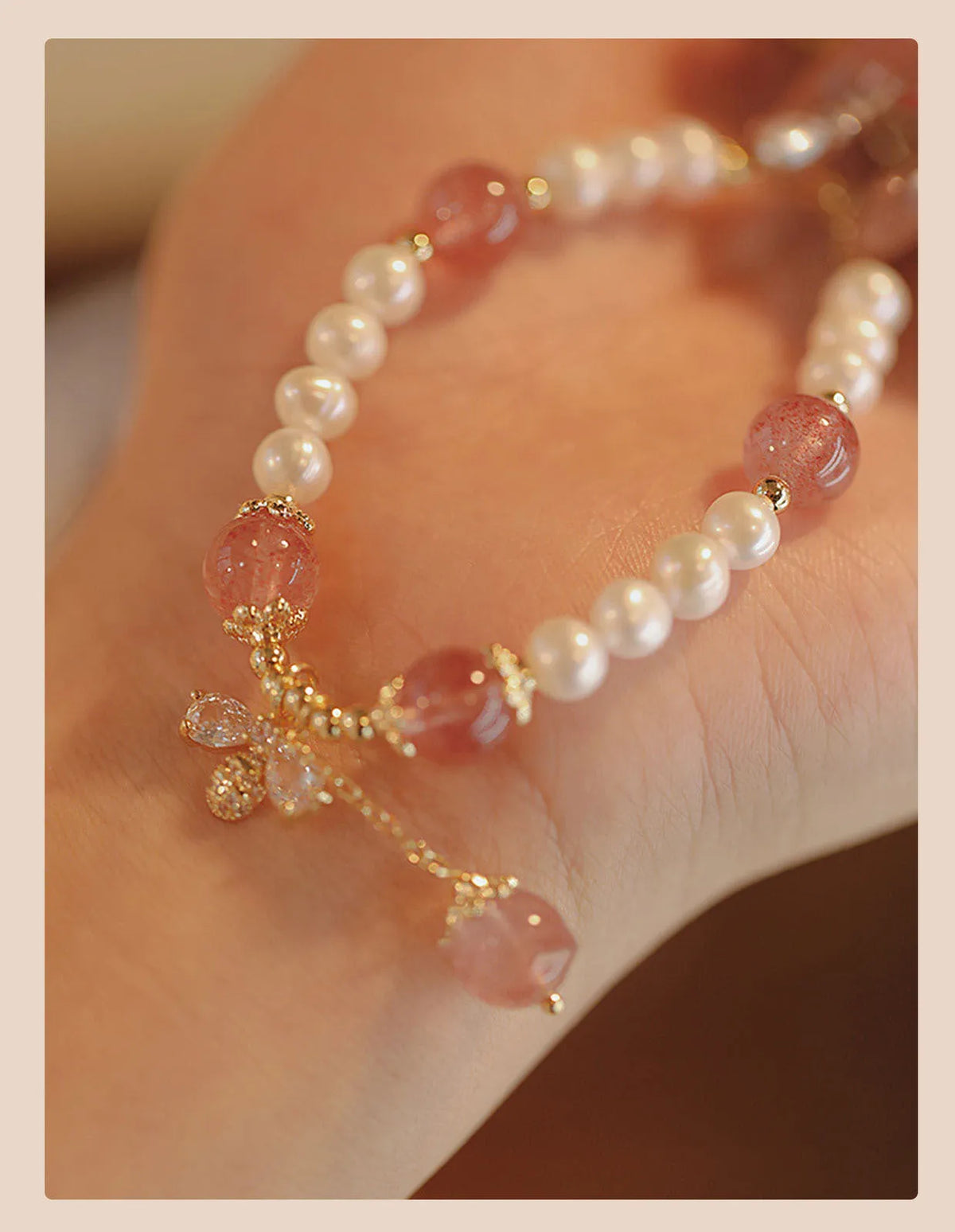 Women's strawberry quartz bracelet with stringed pearls and bow detail in INS style