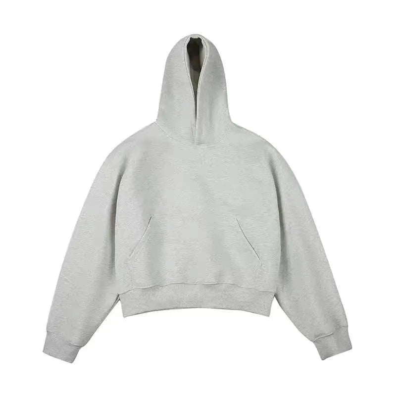Man wearing a dark grey Chinese cotton composite hooded sweater with the hood removed.