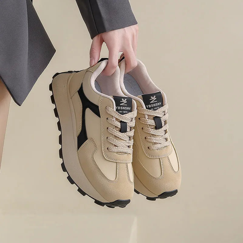 Women's solid colour low-top platform sports shoes with lace-up front and rubber sole.