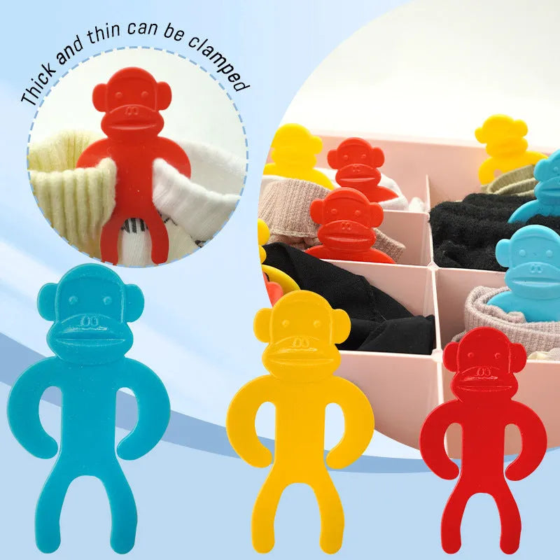 Plastic socks storage clips in blue, red and yellow colours for machine washing organisation