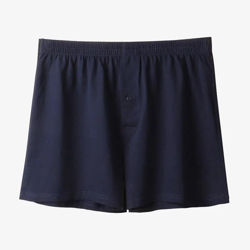 Men's loose fit pure cotton boxer shorts in black, light grey, and navy blue.
