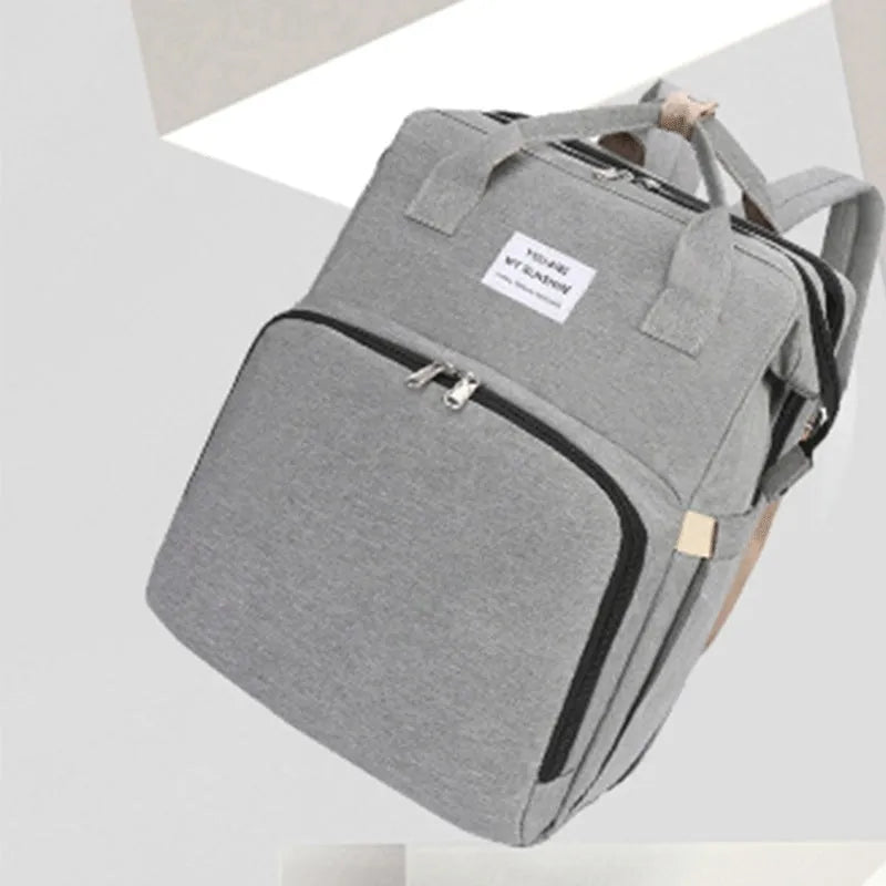 Portable folding mummy bag with USB interface and curved shoulder strap in multiple colour options