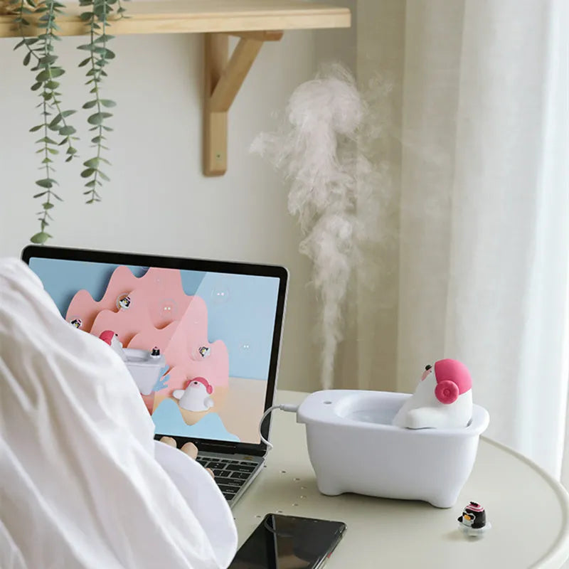 White USB air humidifier with 550ml tank and dual mist modes on a desk