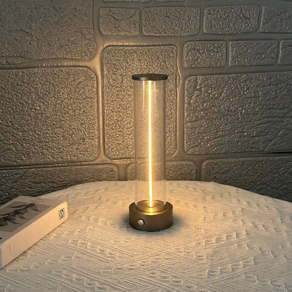 Modern glass LED light strip with magnetic back, measuring 234mm high, on a metal surface.