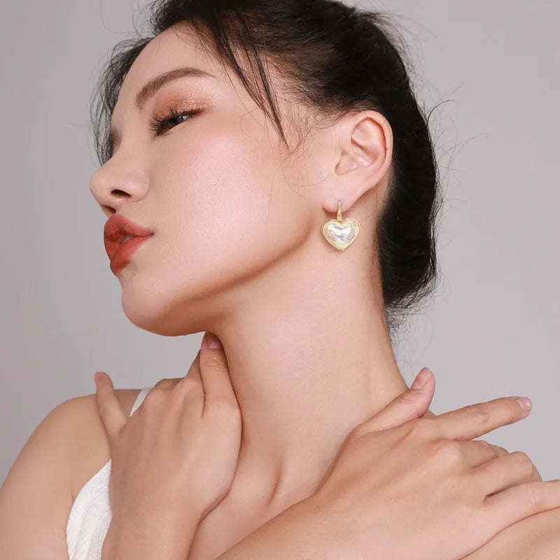 A pair of gold-coloured alloy clip-on earrings for women with a natural style.