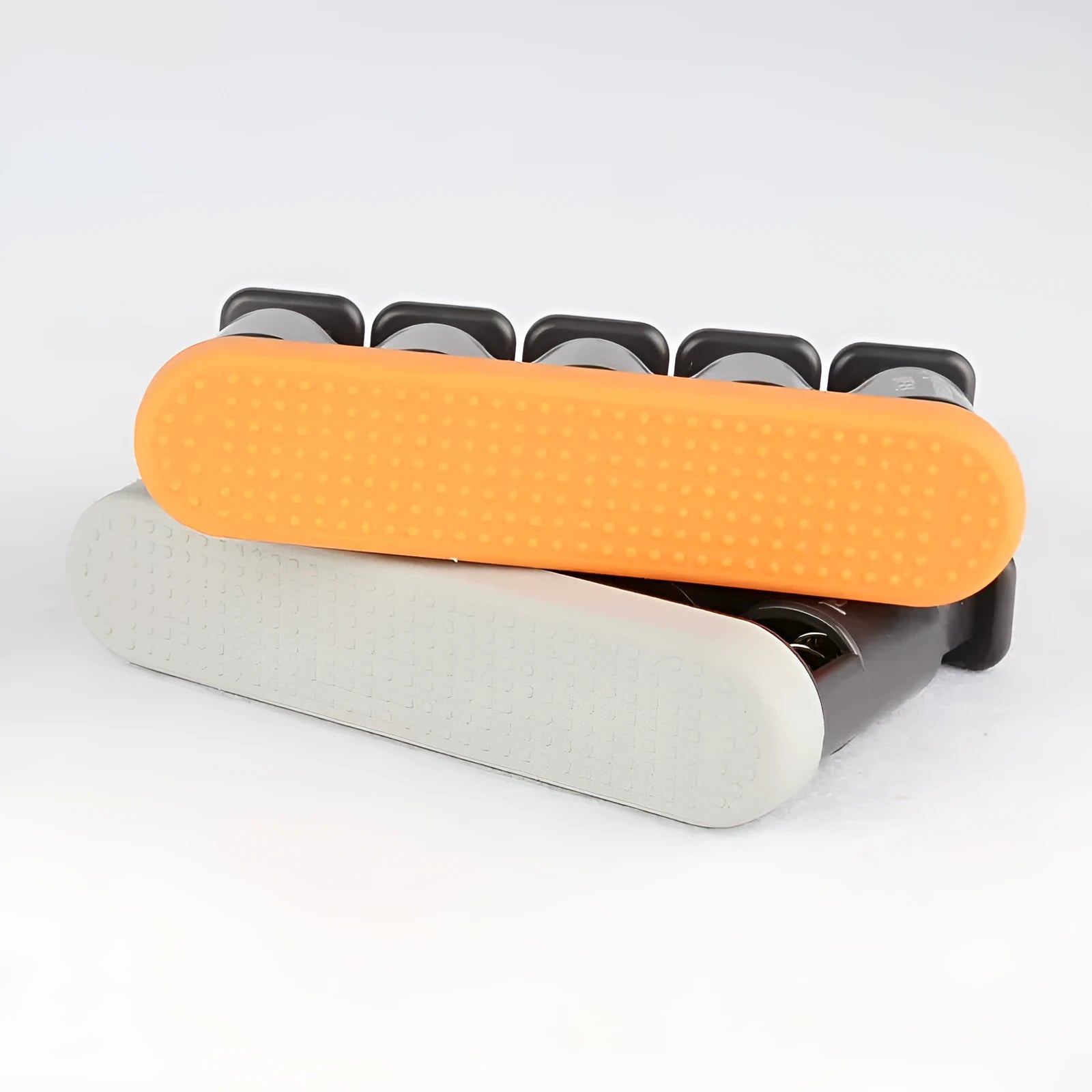 Grey and orange silicone finger trainer for hand strength development