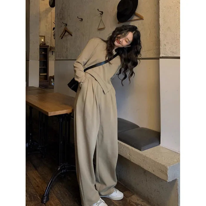 Women's casual sports suit set showing khaki coloured top and trousers with loose fit design