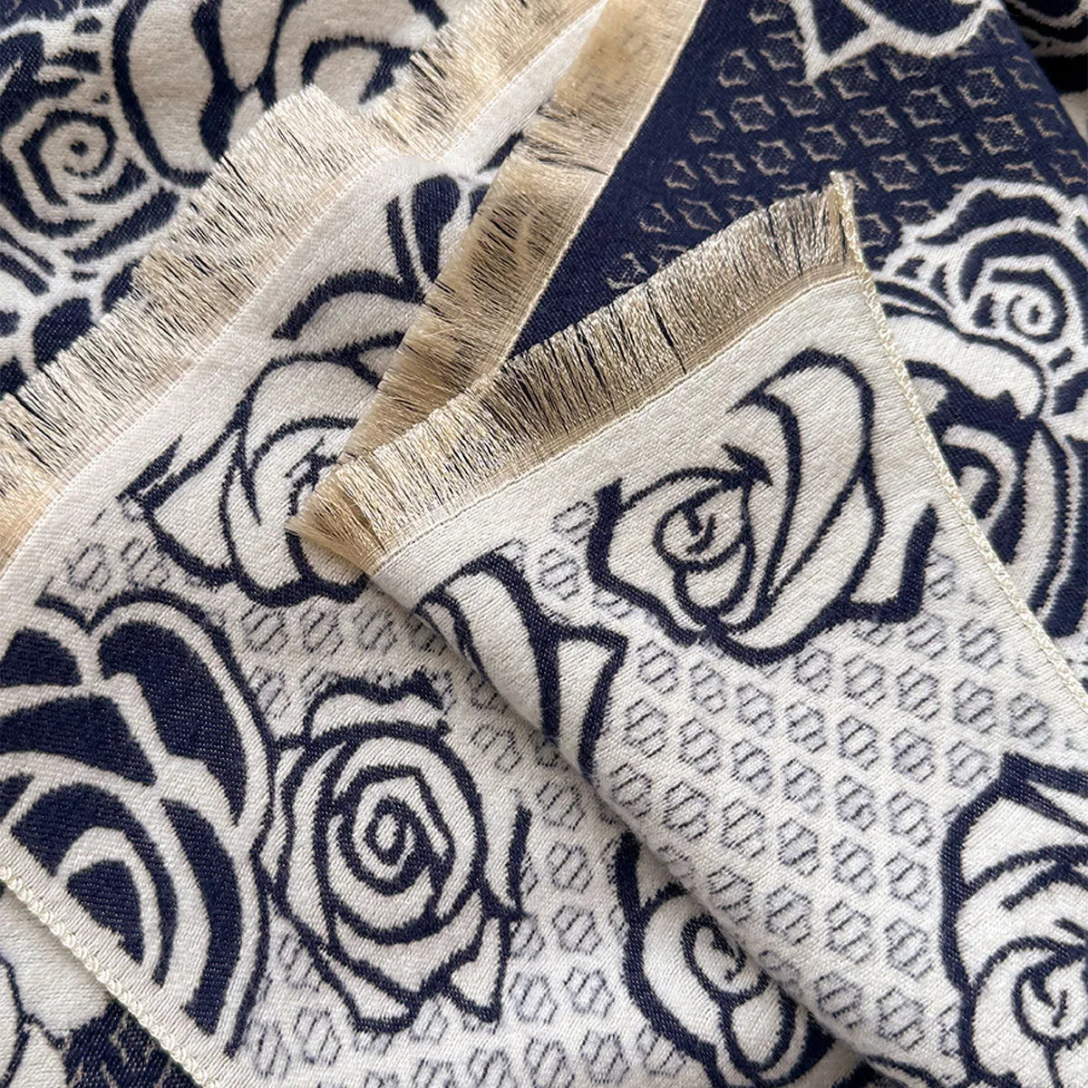 Long gray cashmere-like winter scarf with tassels laid flat showing its 185cm length