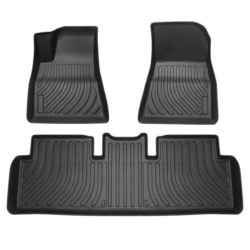 Tesla floor mats made from black rubber with textured TPE footrest section for Model 3, Y, S, and X vehicles