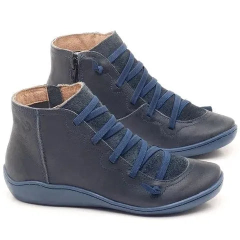 Women's casual black PU booties with a round toe and flat wedge heel on a rubber sole.
