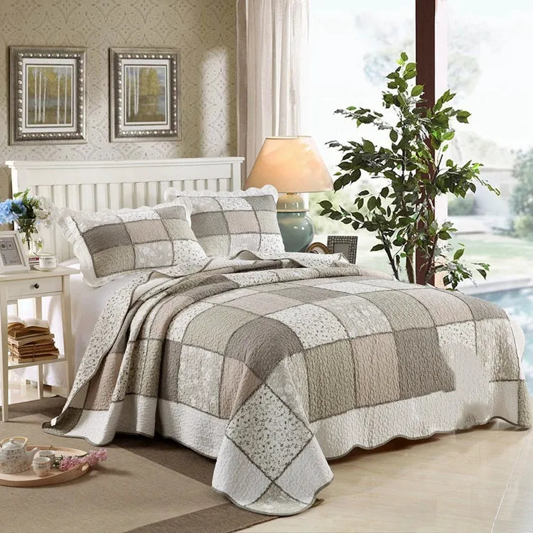 Pure cotton quilted bedspread three-piece set in a chosen pattern, showing the large bed cover and two matching pillowcases.