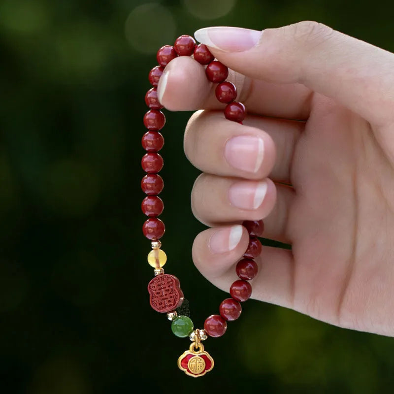 Emperor sandstone Happy Eyebrow Bracelet with cinnabar detail and fu character in New Chinese style.