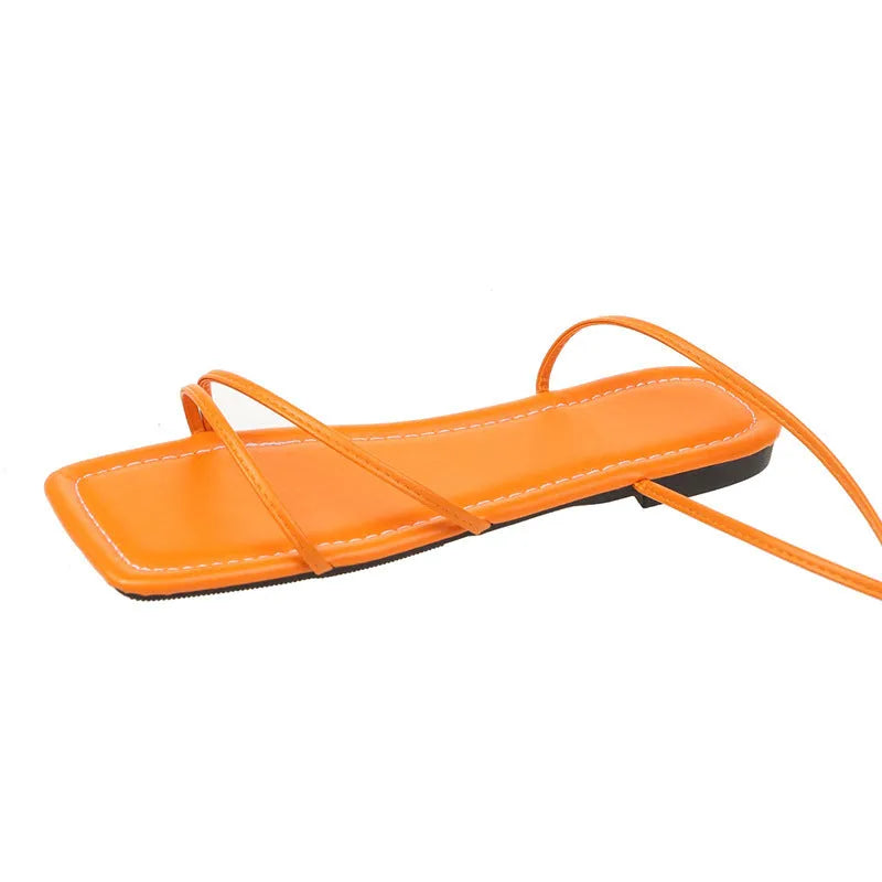 Women's flat sandals with white ankle bandage wrap, square toe, and lace-up front.