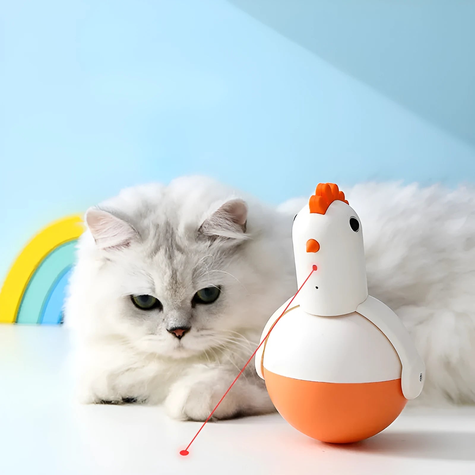 Green and orange electric cat toy chicken with laser and sound features on a flat surface.