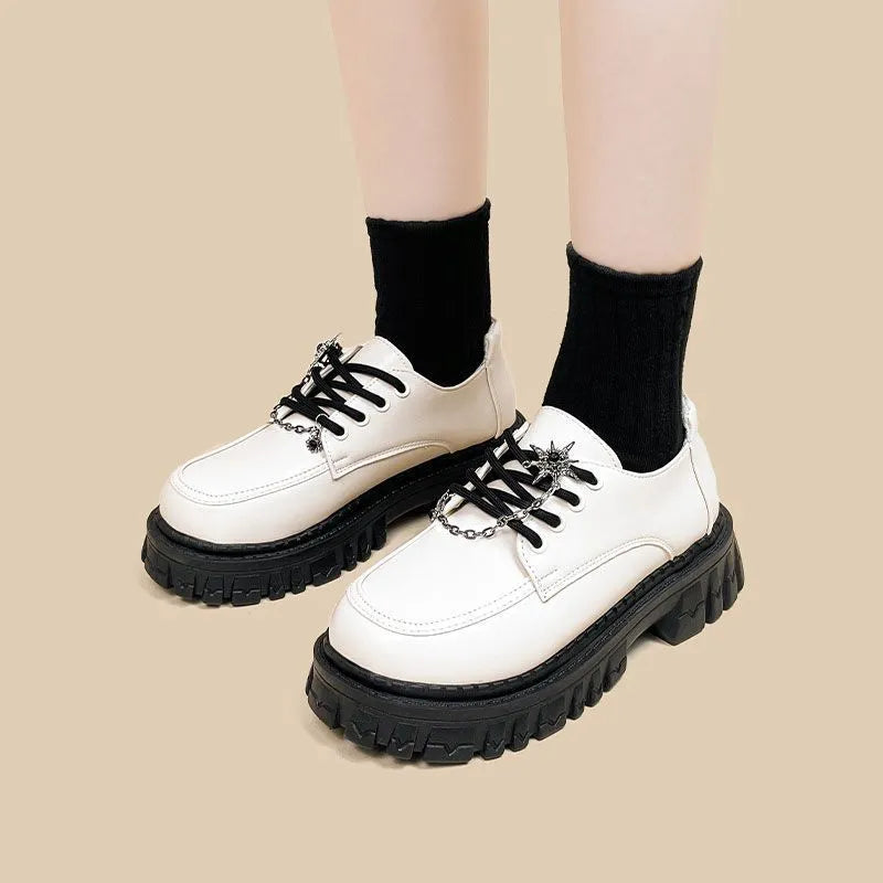 Women's preppy jk style loafers in Duke Asterism colour with metal cross shoulder straps and round toe