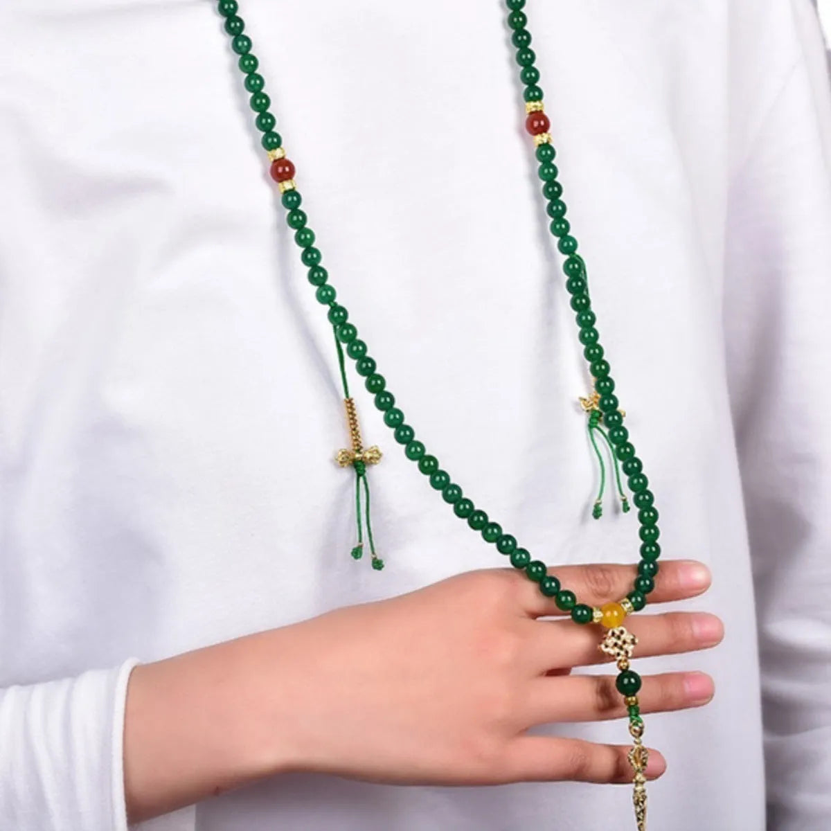 Natural green agate multi-circle bracelet for men and women on a wrist, showing bead detail.