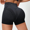 Women's black gradient high-waisted fitness shorts for yoga and running.