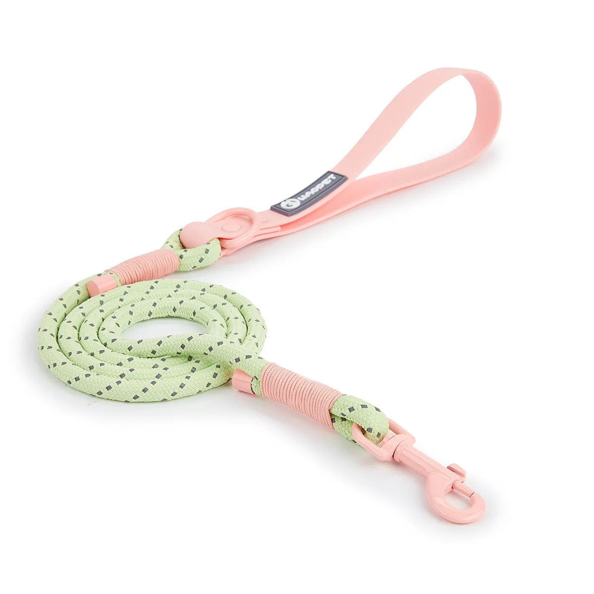 Solid colour PVC dog hand holding rope leash in dark red purple yellow on a green background.