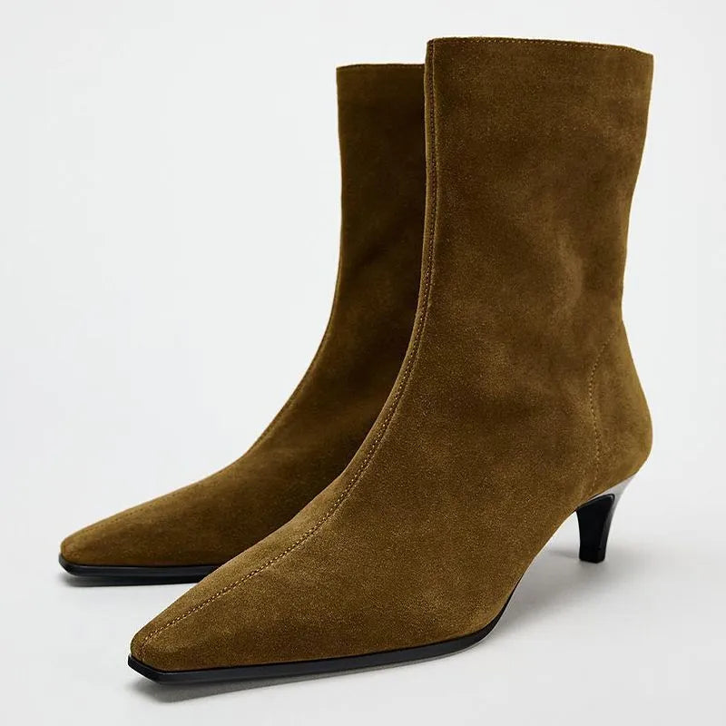 Brown women's square toe ankle boots with side zip and stiletto heel on a waterproof platform sole
