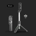 Black Bluetooth selfie stick with wireless remote, extended next to its tripod base.