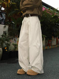 Men's straight leg trousers in striped black, brown and apricot colours with elasticated fabric
