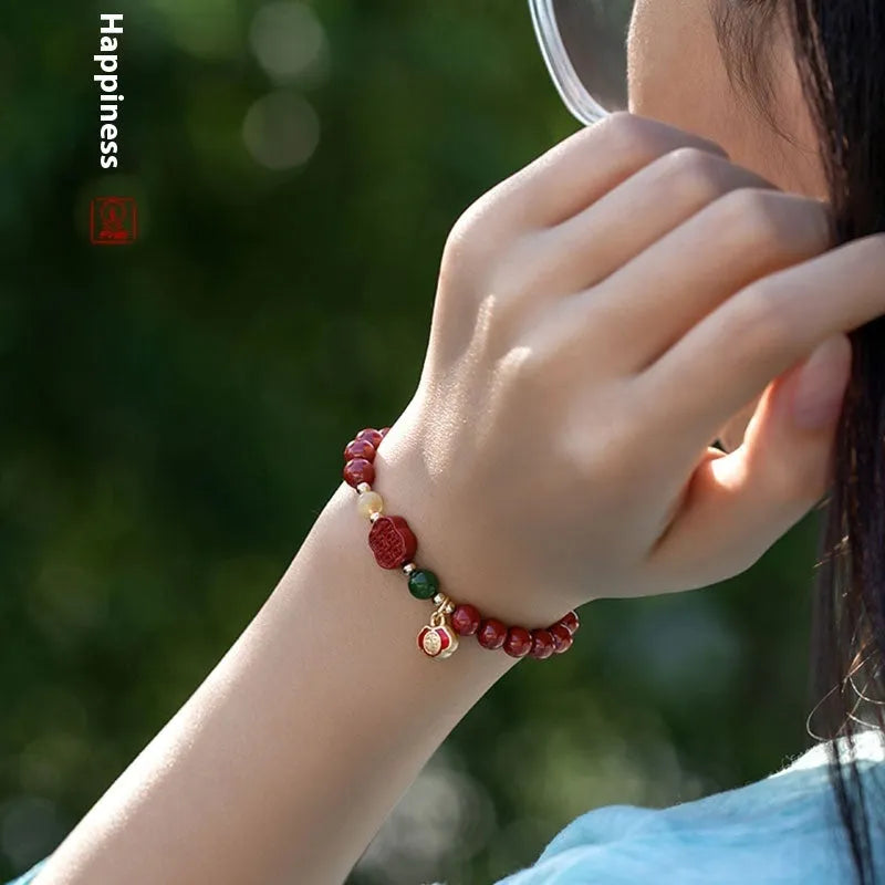Emperor sandstone Happy Eyebrow Bracelet with cinnabar detail and fu character in New Chinese style.