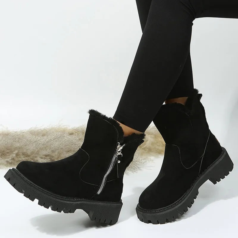 Women's black high-top faux suede snow boot with side zipper and non-slip sole.