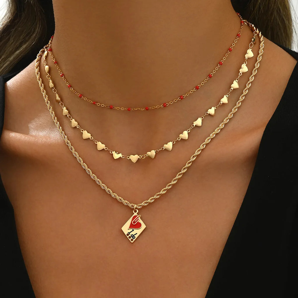Gold-colour clavicle chain necklace with three-layer geometric heart pendant on adjustable chain