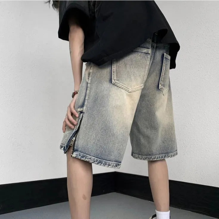 Blue retro-style women's denim shorts with wide leg, loose fit, and tattered detailing on a neutral background.