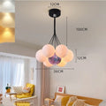 Nordic style gold and black iron LED chandelier with bubble-shaped lights for bedroom or study ceiling.