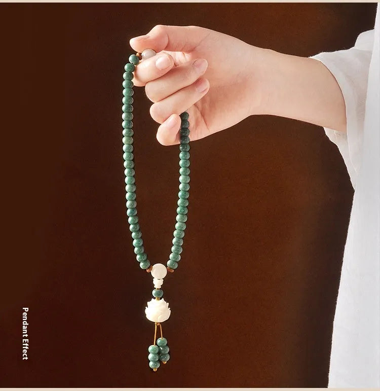 White Jade Bodhi Green Sandalwood beaded bracelet with a double ring clasp.