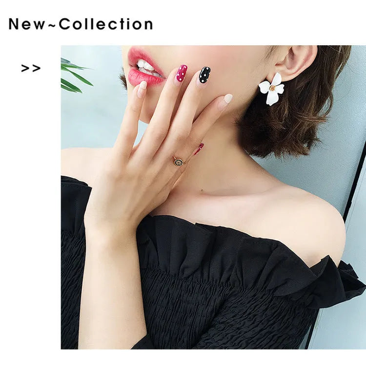 Flower shaped stud earrings in pink and white colours with electroplated alloy finish