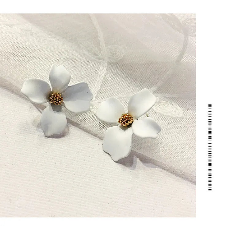 Flower shaped stud earrings in pink and white colours with electroplated alloy finish