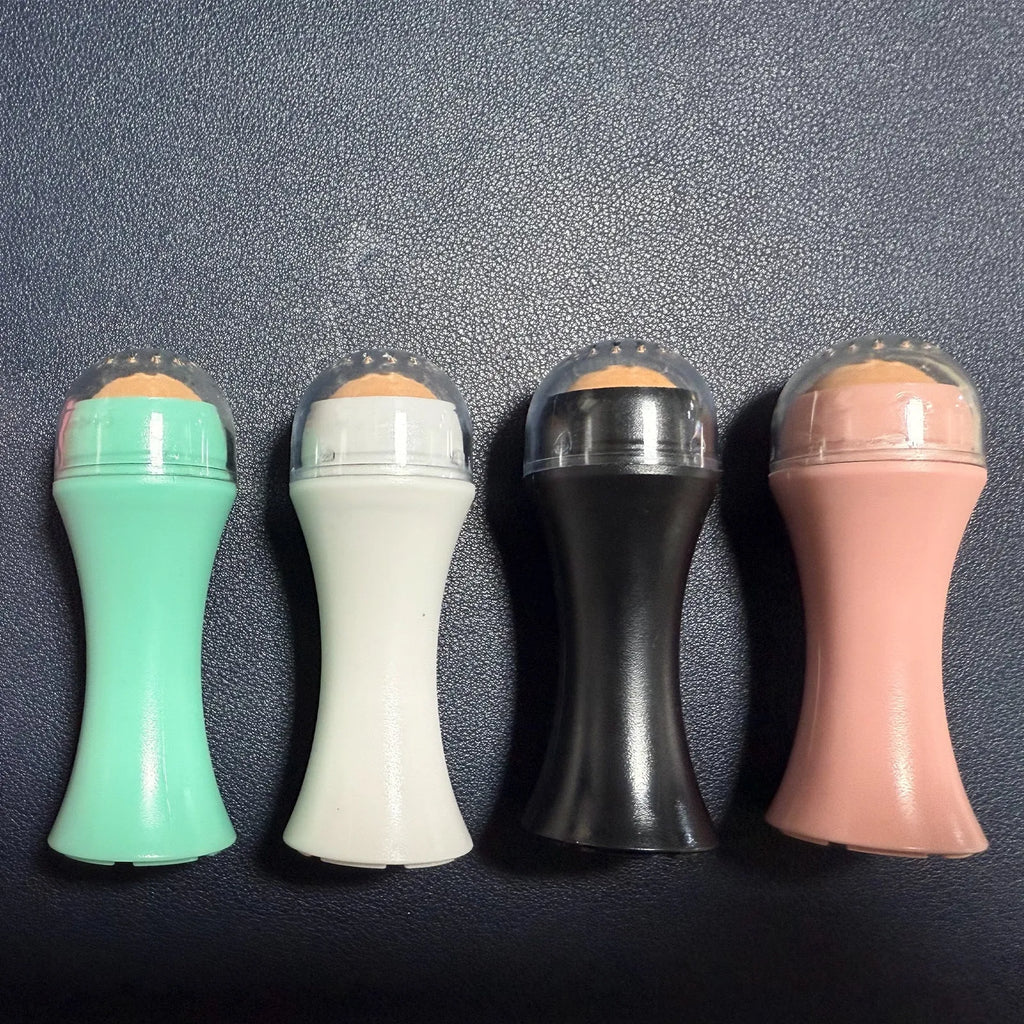 Volcanic stone portable facial roller for oily skin control in black, green, pink, or white.