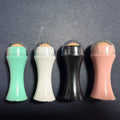 Volcanic stone portable facial roller for oily skin control in black, green, pink, or white.