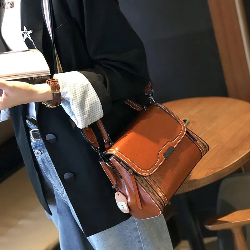 Women's genuine leather retro messenger bag in horizontal square shape with multiple interior compartments